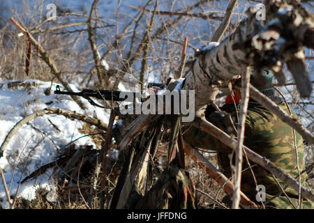 soldier or sniper holding gun Stock Photo