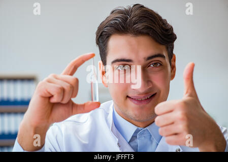 Doctor holding medicines in the lab Stock Photo