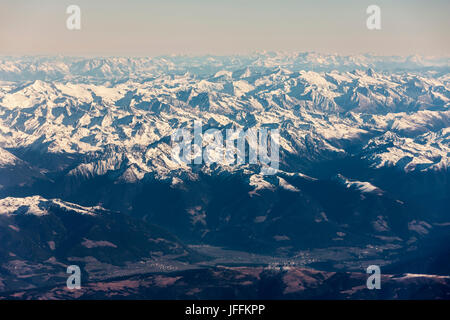 Majestic view of rocky mountains with snow against sky Stock Photo