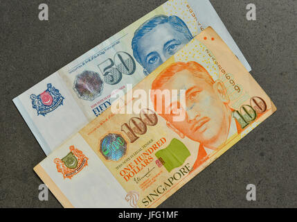 Singapore banknotes (50-100 SGD) - currency concept - close up. Stock Photo