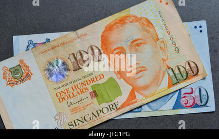 Singapore banknotes (50-100 SGD). Singapore has a highly developed and successful free-market economy. Stock Photo