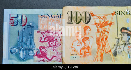 Details of Singapore banknotes (50-100 SGD) - currency concept - close up. Stock Photo