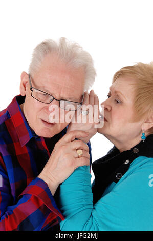 Wife whisper in husband ear. Stock Photo