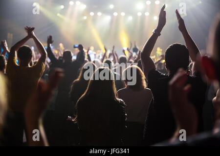 Crowd at concert and blurred stage lights . Stock Photo