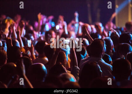 Crowd at concert and blurred stage lights . Stock Photo