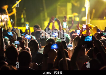 Crowd at concert and blurred stage lights . Stock Photo