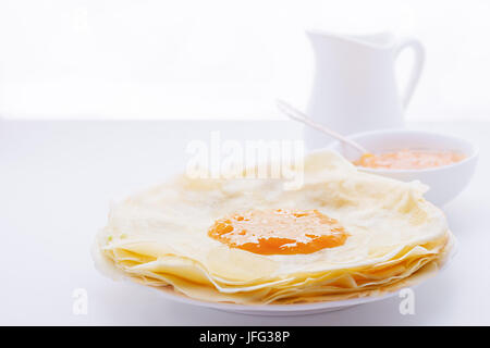 Crispy crepes with apricot jam Stock Photo