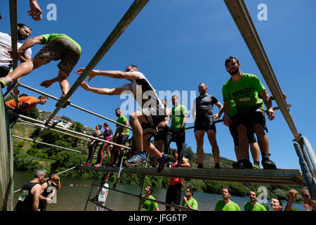 Athletes participating on an obstacle course race Stock Photo