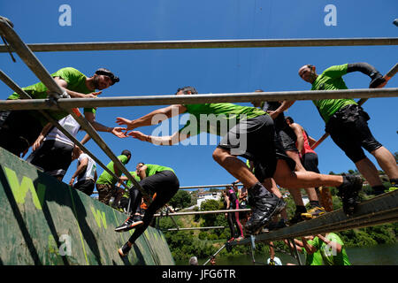 Athletes participating on an obstacle course race Stock Photo