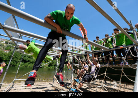 Athletes participating on an obstacle course race Stock Photo