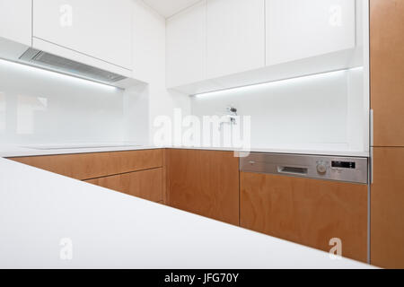 Modern kitchen interior with white and wood cabinets Stock Photo