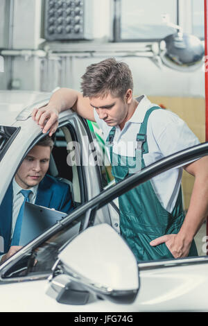 Manager and mechanic Stock Photo