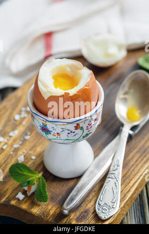 Soft-boiled egg on the stand for breakfast. Stock Photo