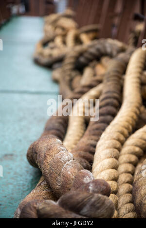 Old Ropes Lying on a Ship Stock Photo