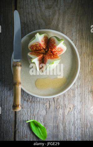 Fresh Juicy fig with a knife Stock Photo