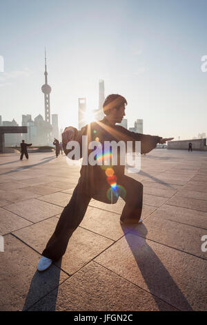 China, Shanghai, The Bund, Man Practicing Tai chi Stock Photo
