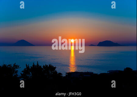 Italy, the Mediterranean Sea, Sicily, Aeolian islands, the Lipari Islands, Salina, sunrise, view at the Panarea and Stromboli at sunrise Stock Photo
