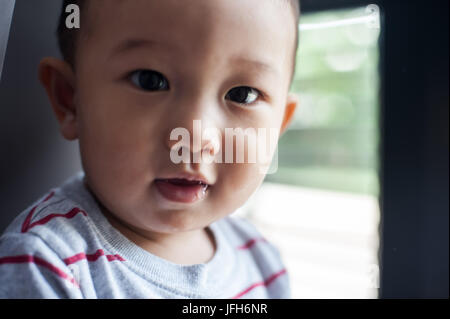 BANGKOK, THAILAND - JUNE 2 : Happy Baby play with balloons at home on JUNE 2, 2014 Bangkok, Thailand Stock Photo