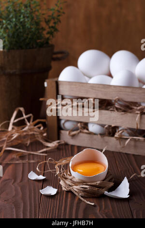 White eggs on brown wooden background Stock Photo