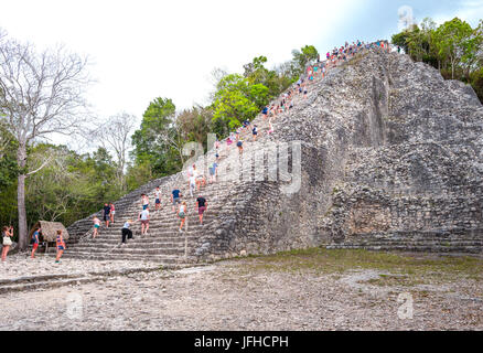 Coba , Mexico - April 20, 2016: Archaeological site, touists climbing the Nohoch Mul pyramid Stock Photo