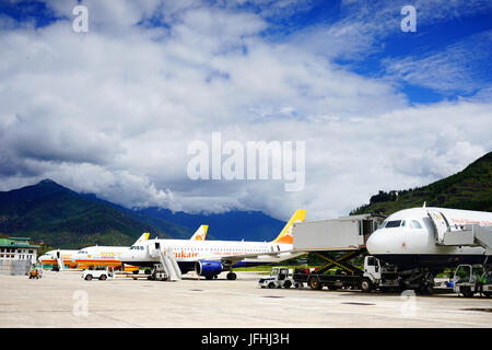 Thimphu, Bhutan - Aug 29, 2015. Airplanes docking at Paro Airport in Thimphu, Bhutan. Thimphu is the capital and largest city of the Kingdom of Bhutan Stock Photo