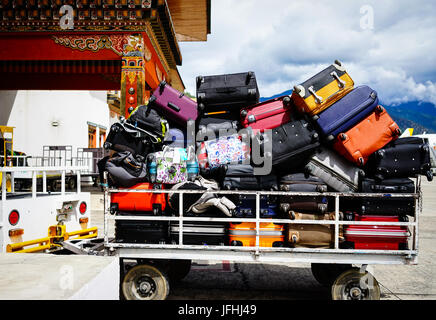 Thimphu, Bhutan - Aug 29, 2015. Loading luggages at Paro Airport in Thimphu, Bhutan. Thimphu is the political and economic centre of Bhutan. Stock Photo