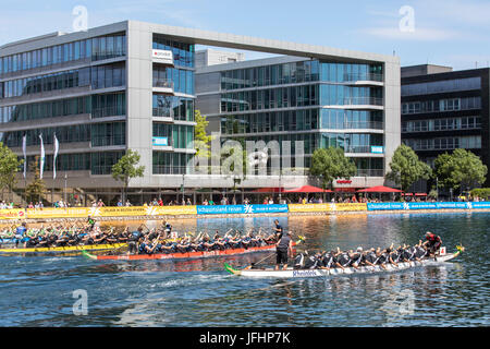 Dragonboat regatta in the inner harbor of Duisburg, Germany, racing in the scenery of old and new harbor buildings, the largest leisure time dragonboa Stock Photo