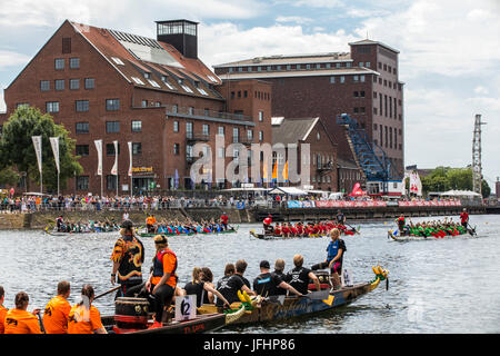 Dragonboat regatta in the inner harbor of Duisburg, Germany, racing in the scenery of old and new harbor buildings, the largest leisure time dragonboa Stock Photo