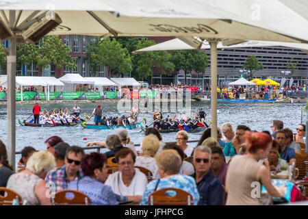 Dragonboat regatta in the inner harbor of Duisburg, Germany, racing in the scenery of old and new harbor buildings, the largest leisure time dragonboa Stock Photo