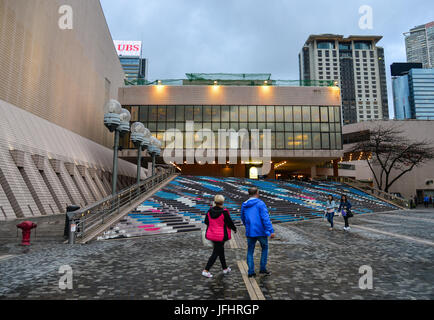 Hong Kong - Mar 31, 2017. People relax at the Museum of Art in Hong Kong, China. Hong Kong ranks as the world fourth most densely populated sovereign  Stock Photo