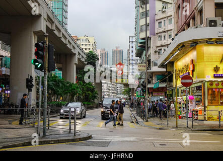 Hong Kong - Mar 31, 2017. People walking on street at Kowloon District in Hong Kong, China. Hong Kong ranks as the world fourth most densely populated Stock Photo