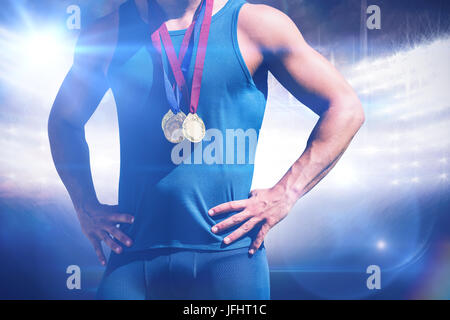 Composite image of portrait of sportsman chest with medals