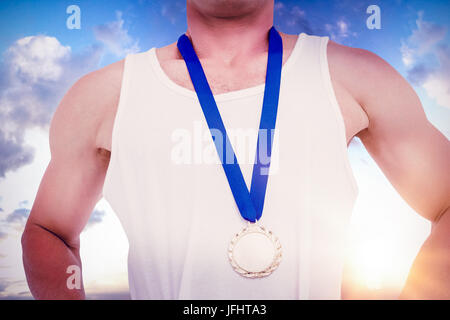 Composite image of close-up of athlete with olympic medal Stock Photo