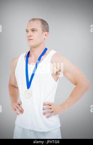 Composite image of close-up of athlete with olympic medal Stock Photo