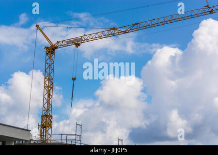 Construction crane against blue sky photographed Stock Photo