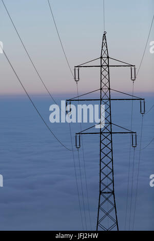 Power poles, nebulous sea, sky, circuit Stock Photo