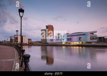 UK, Northern Ireland, Belfast, city skyline along River Lagan with Waterfront Hall, dusk Stock Photo