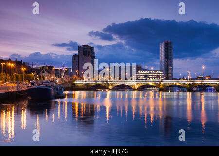 UK, Northern Ireland, Belfast, city skyline along River Lagan, dusk Stock Photo