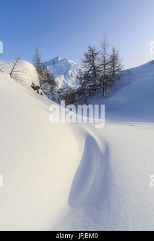 The Piz de la Margna seen from a snow covered valley at the Maloja Pass, Canton of Graubunden, Engadine, Switzerland, Europe Stock Photo