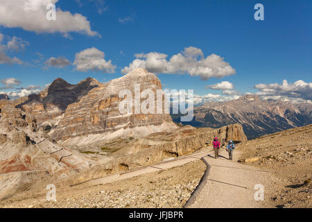 Europe, Italy, Veneto, Belluno, Hikers near the refuge Lagazuoi with Tofana Rozes in the background, Dolomites Stock Photo