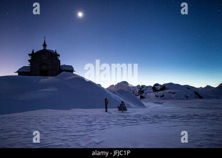 The church at the Alpe Prabello, Prabello Alp in a full moon night, Valmalenco, Valtellina, Italy Stock Photo