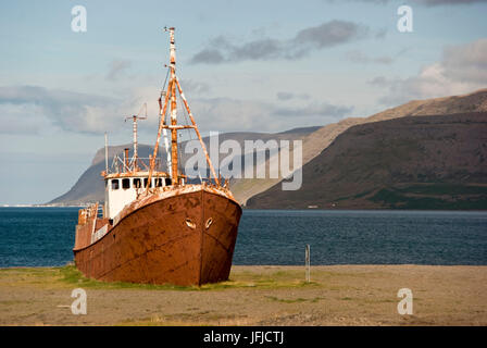 An abandoned fishing boat Grimsby Epine, it's aground on north coast of Iceland, near the sea in the area of fjords, Iceland, Stock Photo