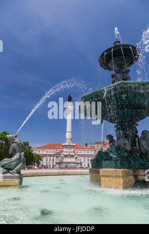 Fountain frames the old palace in Praça Dom Pedro IV also known as Rossio Square Pombaline Downtown of Lisbon Portugal Europe Stock Photo