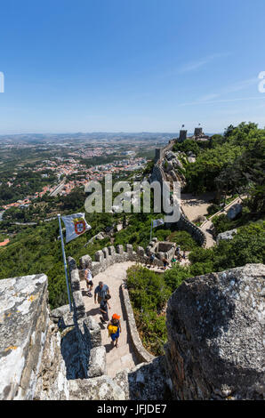 Tourists proceed on fortified stone path of the ancient Castelo dos Mouros Sintra municipality Lisbon district Portugal Europe Stock Photo