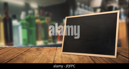 Composite image of bottles arranged on a shelf Stock Photo