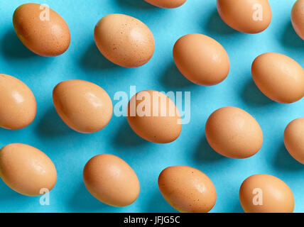 pattern of eggs on blue background, top view Stock Photo