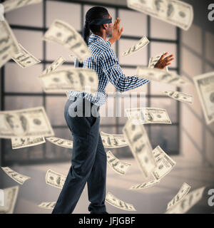 Composite image of blindfolded businessman with arms out Stock Photo