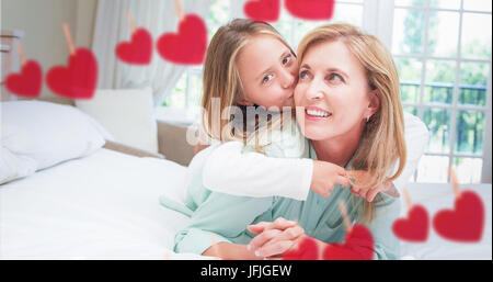 Composite image of Mother and daughter holding each other Stock Photo