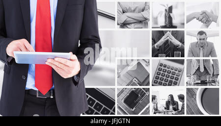 Composite image of businessman scrolling on his digital tablet Stock Photo