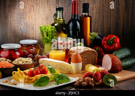 Composition with variety of organic food products on kitchen table Stock Photo